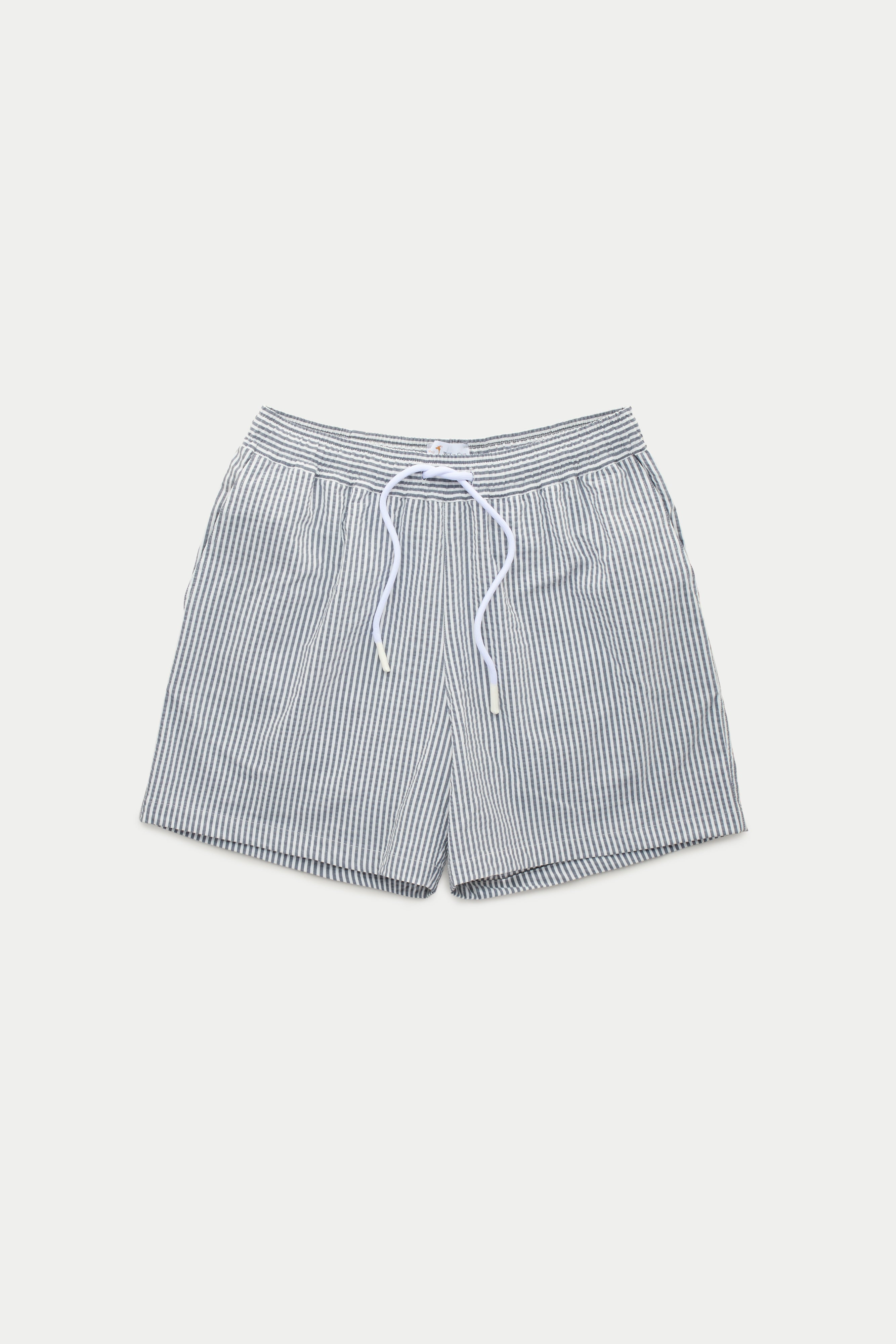 Wolf vs Goat Navy Seersucker Swim Shorts: Shop Now